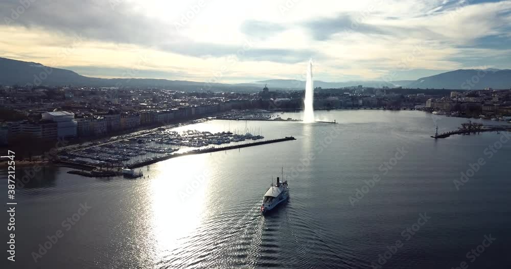 Vue aérienne du bateau de la CGN en destination de Genève, Suisse, lors d'un coucher de soleil d'hiver. Aerial view of CGN's boat going to Geneva, Switzerland. Winter sunset. Vue aérienne du bateau de la CGN en destination de Genève, Suisse, lors d'un coucher de soleil d'hiver. Aerial view of CGN's boat going to Geneva, Switzerland. Winter sunset.