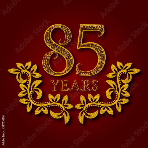 Eighty five years anniversary celebration patterned logotype. Eighty fifth anniversary vintage golden logo with shadow.