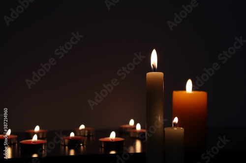 Candle black background of mourning funeral moment of silence 