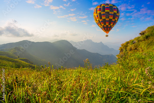 Colorful hot-air balloons flying over the mountain