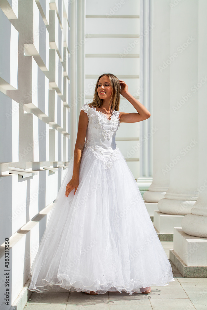 Young beautiful girl in ballroom prom dress Young beautiful girl in ballroom prom dress
