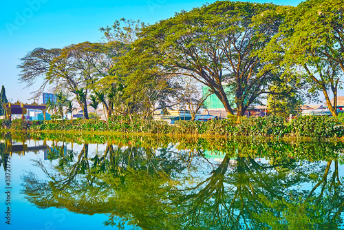 Walk by Tharzi pond, Nyaungshwe, Myanmar photo