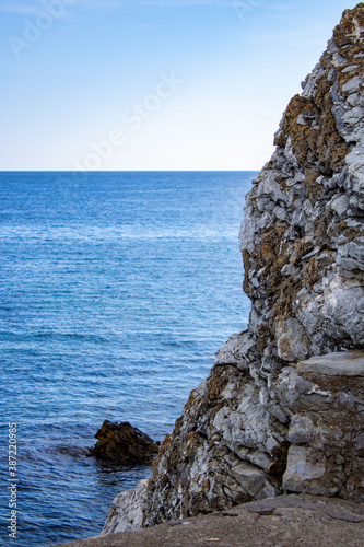 Textured stone. Layers of stones on the background of the sea. Rock. Close-up