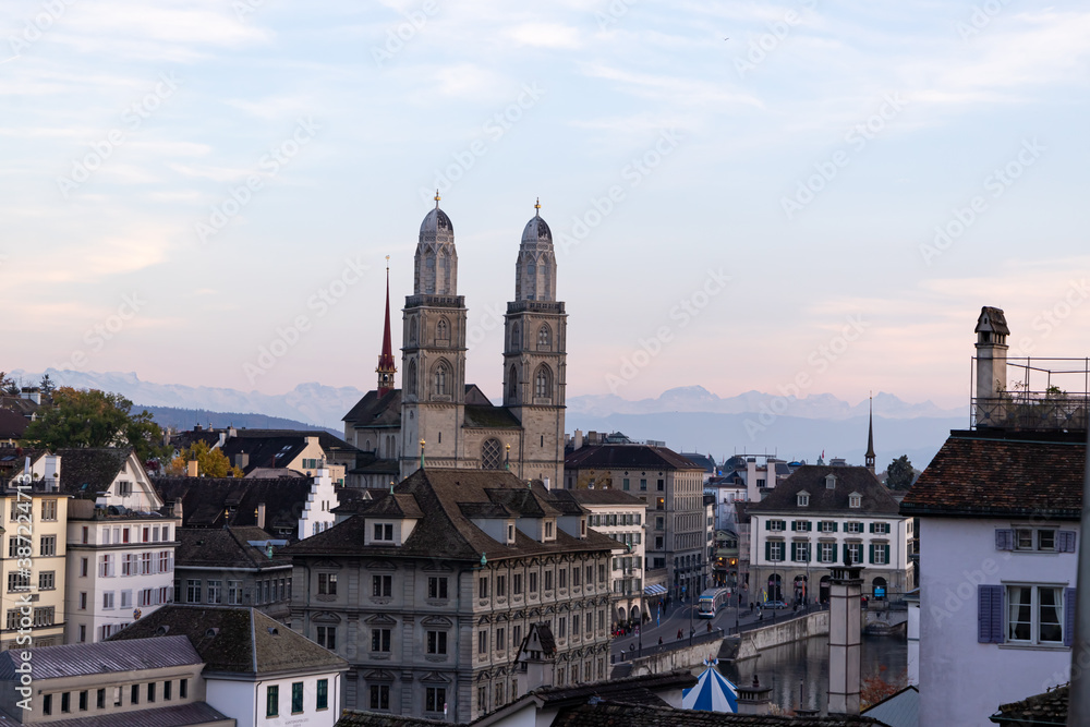 Grossmunster, Zurich Town Hall and the Alps seen from Lindenhof in Zurich Switzerland