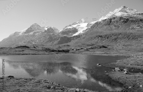 Swiss alps: Glacier lake Bianco in the swiss alps mountains on Bernina in the Engadina