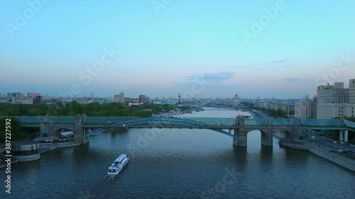 twilight moscow river famous gorky park pedestrian bridge aerial flight over panorama 4k russia photo