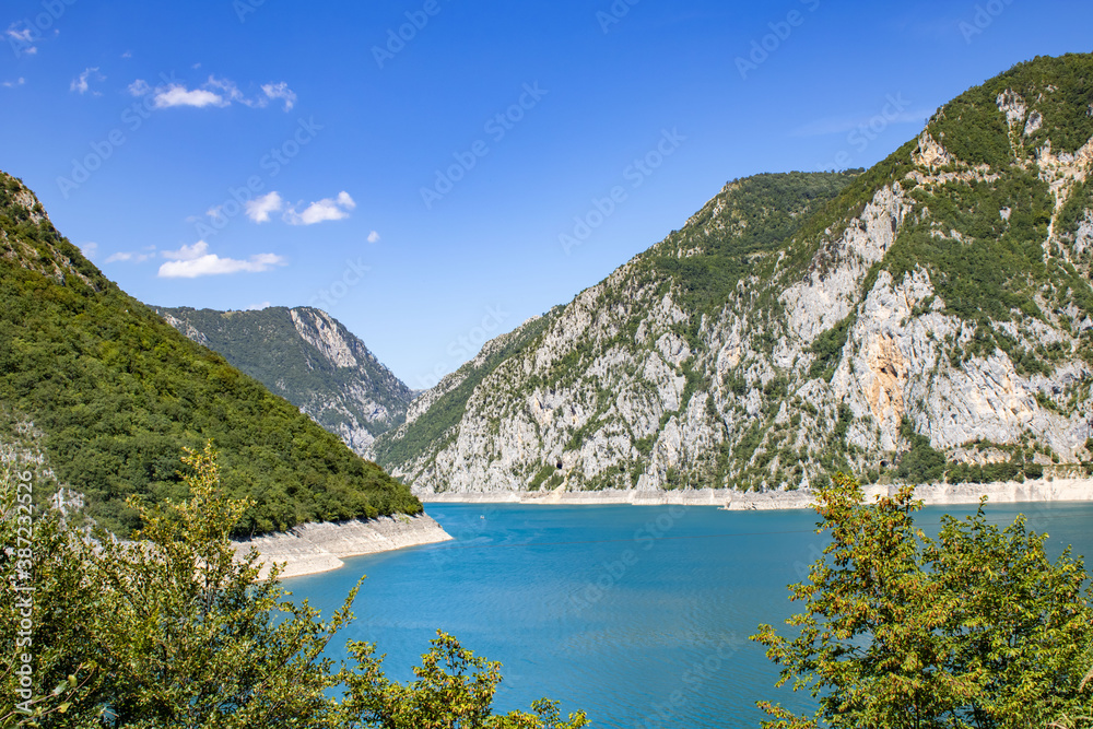 The famous Piva river canyon with its fantastic reservoir Piva Lake (Pivsko Jezero) summer view in Montenegro. Nature travel background.