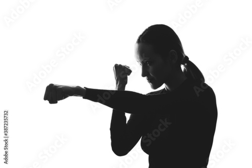 black and white silhouette portrait of woman  strike  defense concept