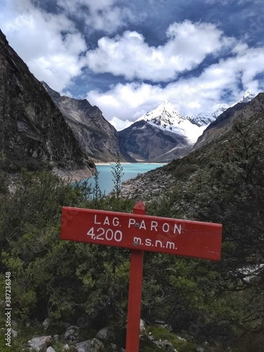 Sign at Laguna Paron, Huaraz, Peru. A blue-green lake in the Cordillera Blanca on the Peruvian Andes. At 4185 meters above sea level, it's surrounded by snowy peaks and a pyramid mountain. 
