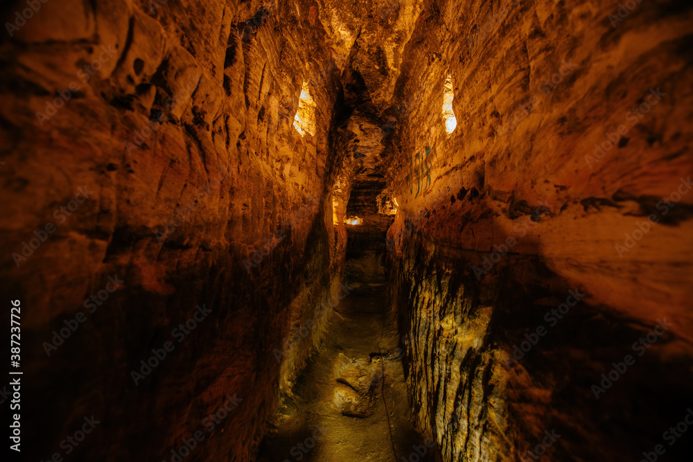 Ancient narrow underground passage in sandstone at old underground monastery Ancient narrow underground passage in sandstone at old underground monastery