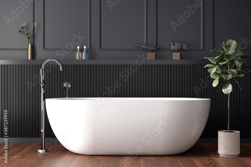 Fotografia White free standing baththub in a dark paneled bathroom