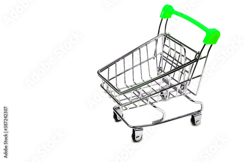 Empty shopping cart with green handle isolated on white background, buy and sell concept.