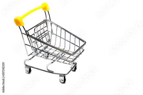 Empty shopping cart with yellow handle isolated on white background, buy and sell concept.