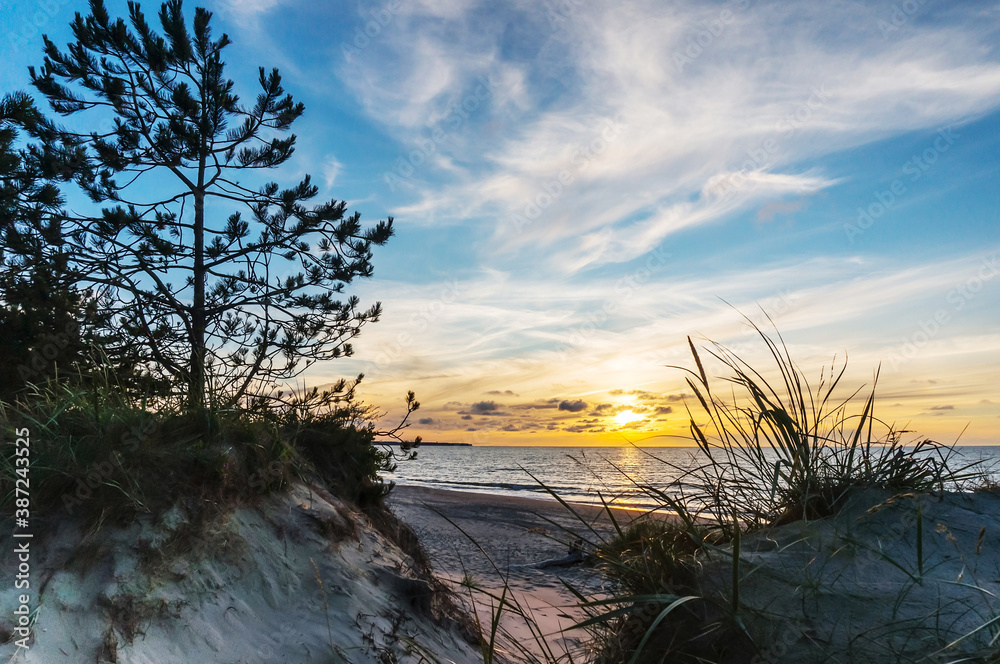 Sunset over the sea. Reflection of sunlight in the sea waves. The sky in the sunset rays. Russia Baltic Sea. Sunset over the sea. Reflection of sunlight in the sea waves. The sky in the sunset rays. Russia Baltic Sea.