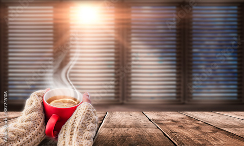 Red cup of hot tea in the i...