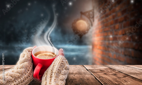 Red cup of hot tea in the i...