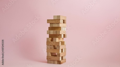 Game with wooden blocks. Tower. From the beginning of the game to the destruction of the building. Stop motion video. photo