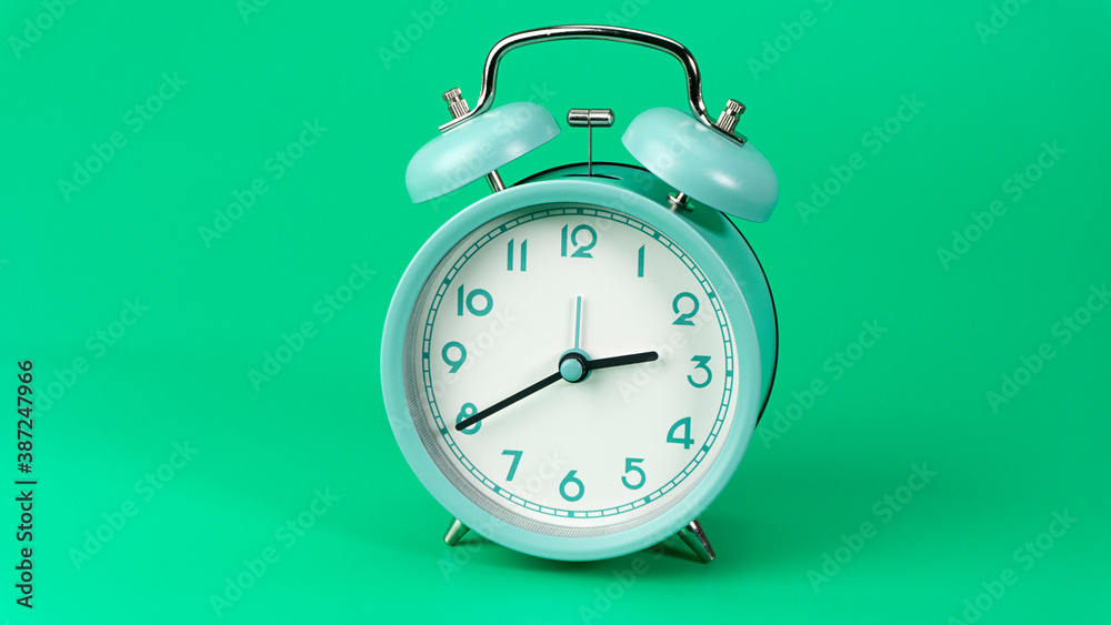 Alarm clock isolated beginning time 02.40 am or pm. on green background, Time concept.. Alarm clock isolated beginning time 02.40 am or pm. on green background, Time concept..