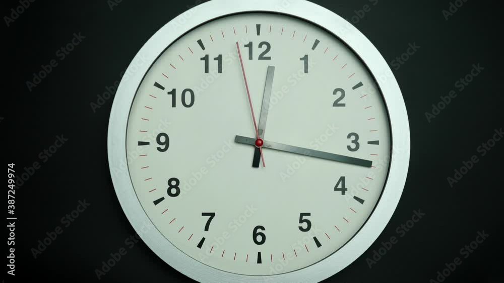 Gray watch isolated on black background, Showtime 12.17 am or pm, Red second hand minute Walk, Time concept. Gray watch isolated on black background, Showtime 12.17 am or pm, Red second hand minute Walk, Time concept.