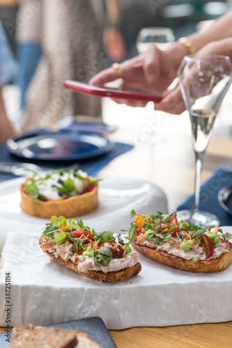 Crostini with Tuna Pate and Fresh Tomatoes. Brunch in Restaurant