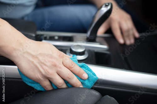 close up of hand cleaning car interior © auremar