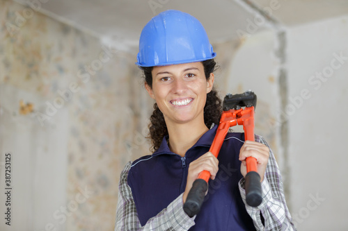 worker woman with scissors mower over white background