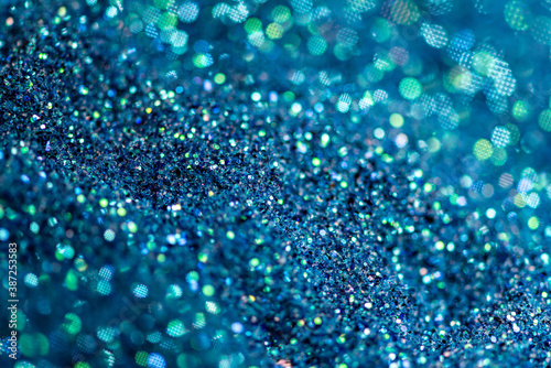 abstract of bright and sparkling bokeh background, blue, green and silver bokeh, blurred lighting from glitter texture, soft focus