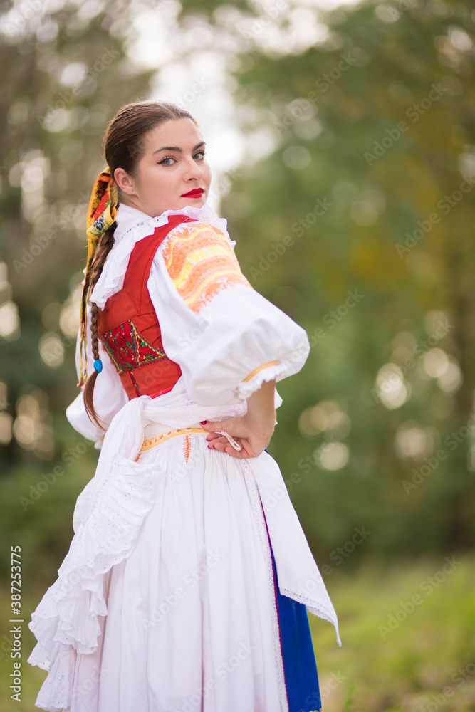 Beautiful woman wearing traditional Eastern Europe folk costumes. 
Slovak folklore.