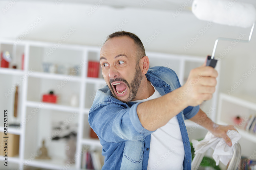 Fototapeta premium an angry man while painting
