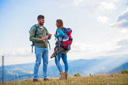 Young couple taking a break on a hike.