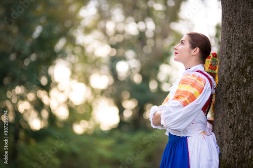 Beautiful woman wearing traditional Eastern Europe folk costumes. Slovak folklore.