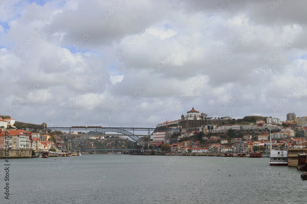 The picturesque city of Porto overlooking the central bridge of Ponte Luis I.