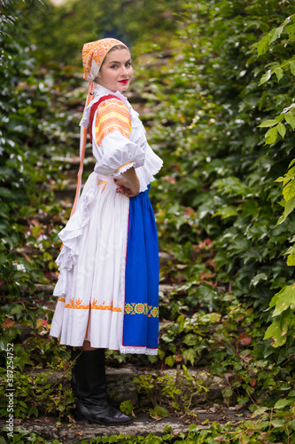 Beautiful woman wearing traditional Eastern Europe folk costumes. Slovak folklore.