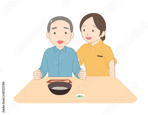 お粥を食べる高齢男性　女性介護士(線無し)