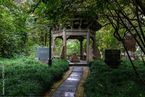 Tomb of Ding Henian in the pavilion, great poet & Xiaozi or filial son in Yuan dynasty, by West Lake or Xihu, Hangzhou, Zhejiang, China. He was a muslim from Western region.