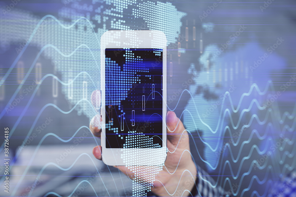 Double exposure of man's hands holding and using a digital device and forex graph drawing. Financial market concept. Double exposure of man's hands holding and using a digital device and forex graph drawing. Financial market concept.