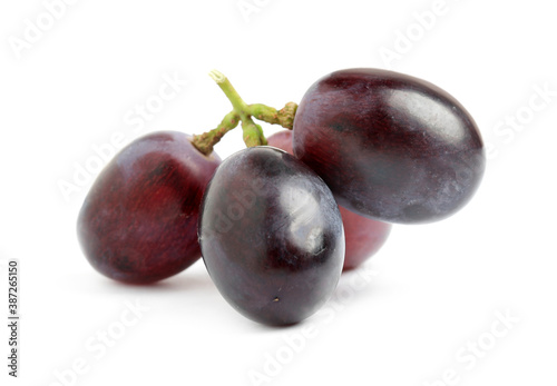 Delicious ripe purple grapes isolated on white