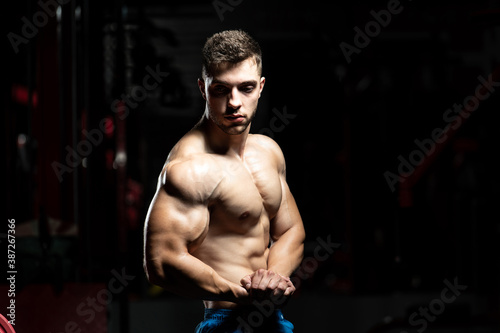 Man In Gym Showing His Well Trained Body