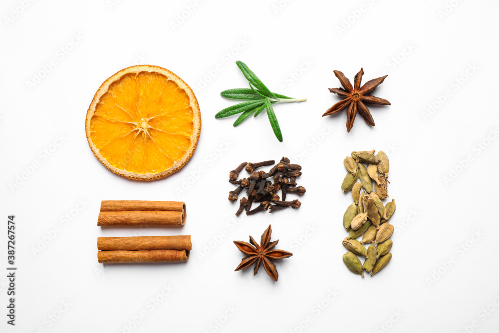 Different mulled wine ingredients on white background, flat lay