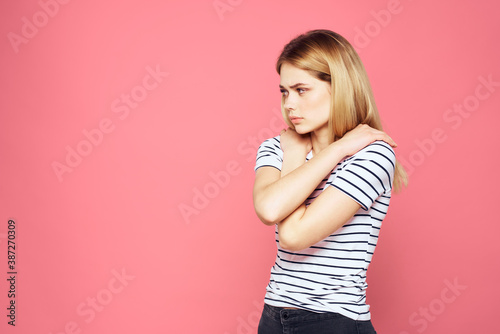 Woman in striped t-shirt emotions studio cropped view lifestyle pink isolated background