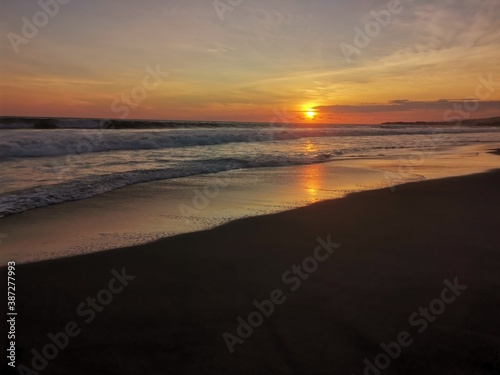 sunset on the beach © Erick