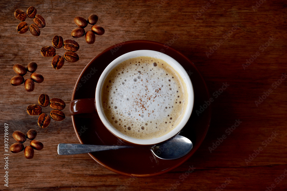 Cup of coffee and coffee beans put on the wooden Cup of coffee and coffee beans put on the wooden