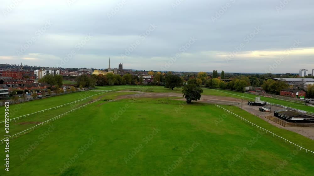 Drone shot flying over Worcester Race Course towards the cathedral and public library Drone shot flying over Worcester Race Course towards the cathedral and public library