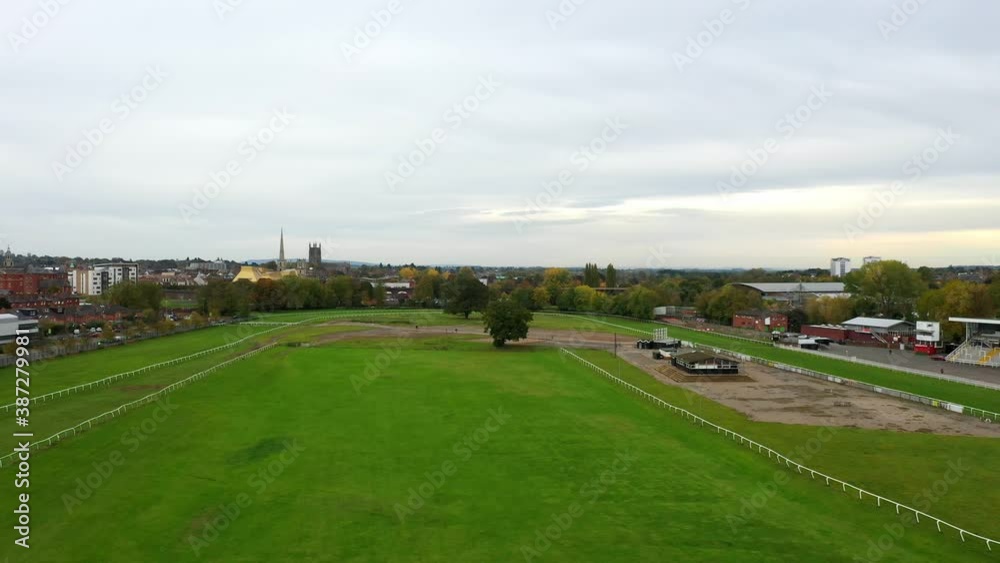 Drone shot flying over Worcester Race Course towards the cathedral and public library Drone shot flying over Worcester Race Course towards the cathedral and public library