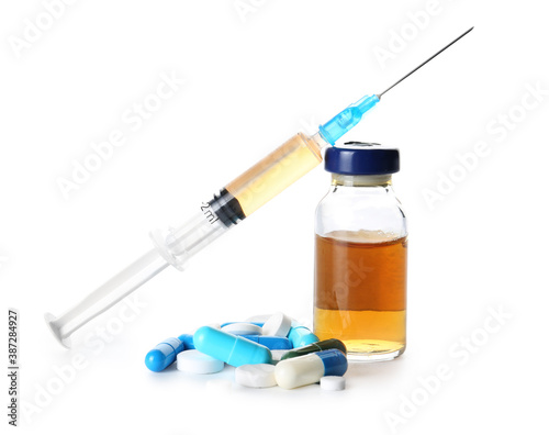 Syringe with drugs on white background