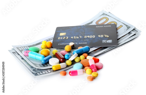 Drugs and money on white ba...