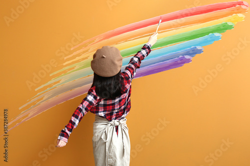 Cute little girl painting r...