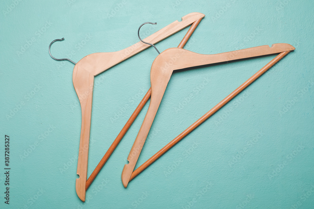 Clothes hangers on color background Clothes hangers on color background