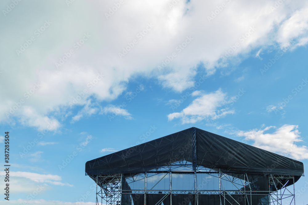 concert stage roof with sky and clouds..