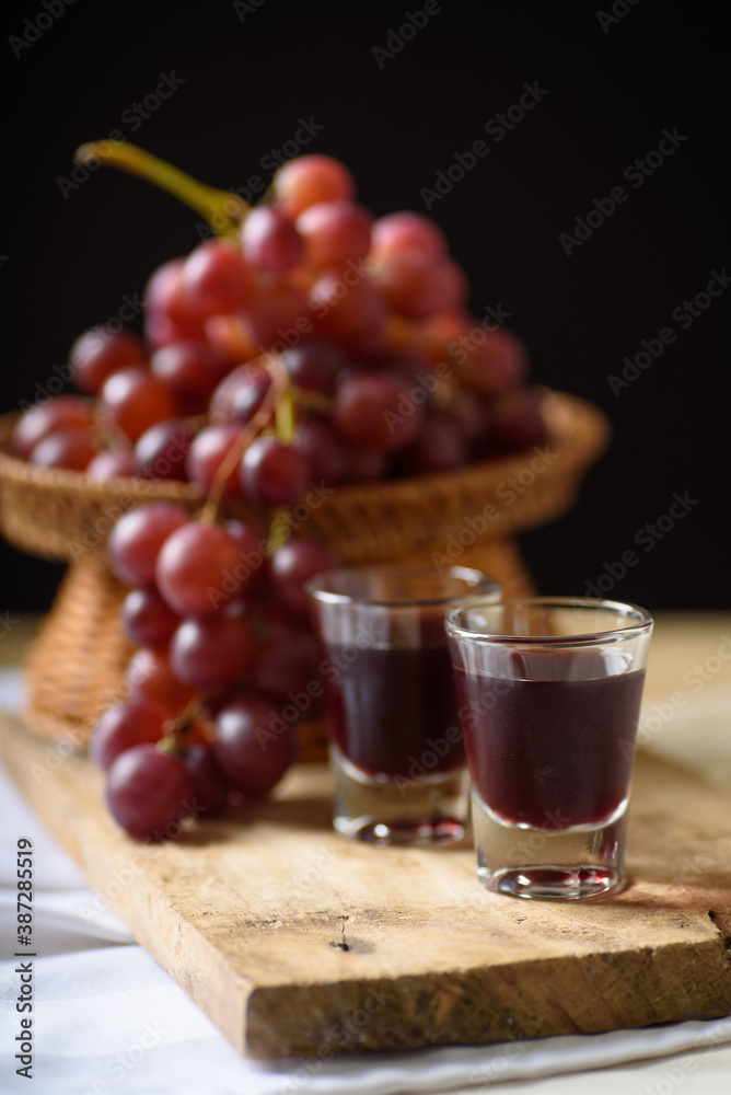 Red grape juice in glass with grape fruit
Red grape juice in glass with grape fruit